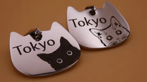 The tags feature unique client-submitted graphics, intricate illustrations, and unlimited text—capabilities that exceed traditional pet store machines—crafted at TechArt Concept.