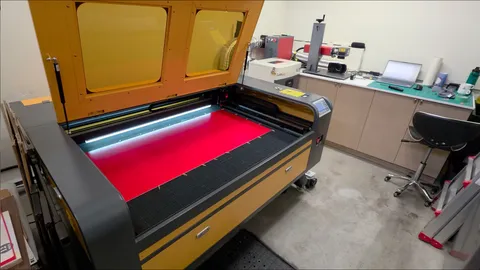 Laser engraved red parking signs for a dental clinic inside a fabrication shop.