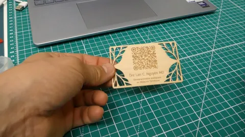 Smartphone scanning a laser-cut wooden NFC smart business card to instantly import contact details.